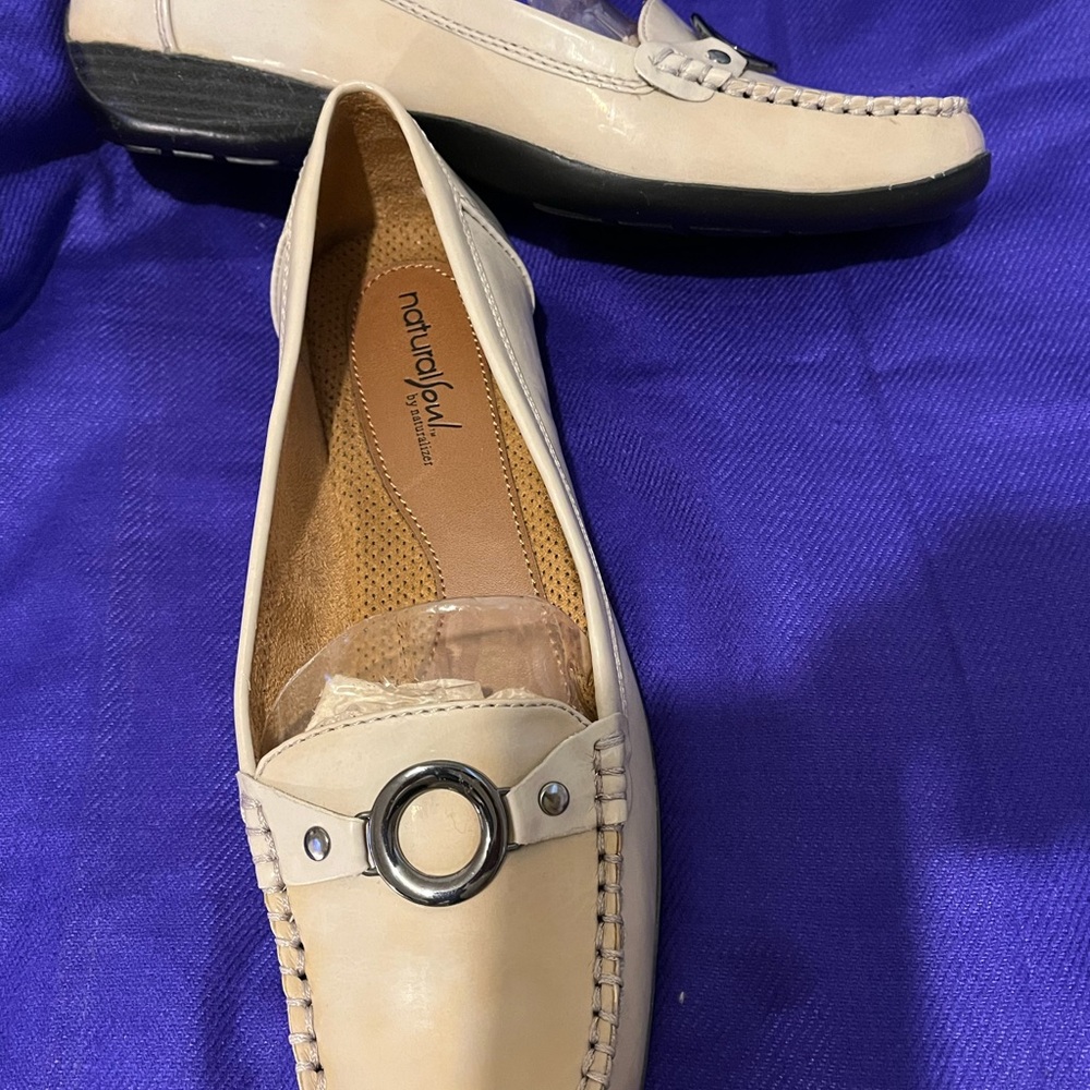 Natural Soul Cream and Silver Flats with Rounded Toe and Decorative Ornament